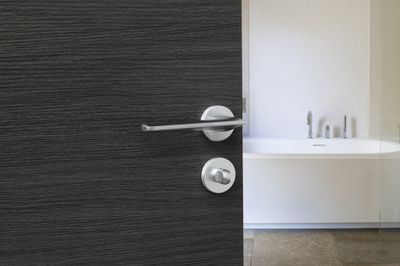 Poignées de porte sur rosaces rondes sans trou Boston chrome satiné FROSIO