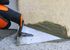 Truelle triangulaire 140 mm avec manche bi-matière FISCHER DAREX